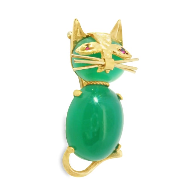 Charming Estate 14K Yellow Gold Cat Brooch featuring a natural aventurine body and ruby eyes , beautifully crafted in a...