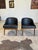Mid century modern lounge chairs by Kodawood, featuring molded walnut frames, tapered legs and black vinyl seats and back....