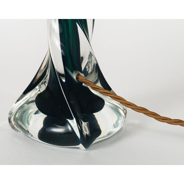 A vintage table lamp base of twisted form made of heavy mouth-blown cased glass, with a rich, dark emerald / forest green...