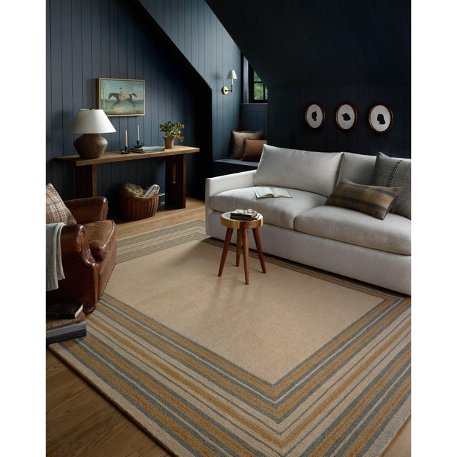 The Alfie Collection from Chris Loves Julia x Loloi is a handmade area rug with a playful framed design, a modern update...