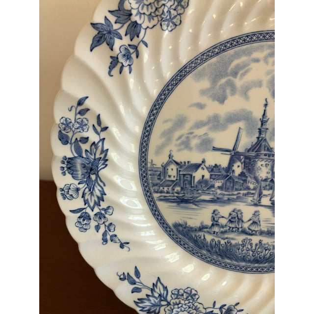 Charming English transferware from Johnson Brothers in the popular Tulip Time pattern. The center displays a detailed...