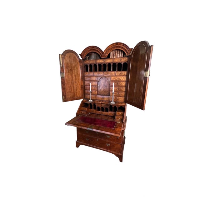 George I Inlaid Burr Walnut Double Done Bureau Bookcase circa 1720 In two parts with a double arched molded cornice above...