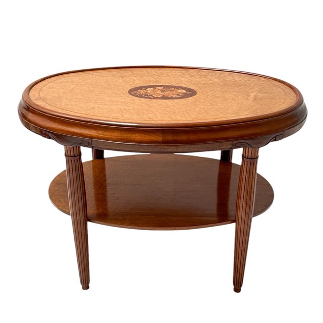 Stunning and elegant Art Deco center table. Striking French design from the 1930s. Solid walnut frame with original...