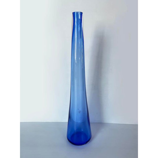 Particular vase entirely in blue Murano glass with transparent details at the neck. Dimensions: H 58 x Base diameter 12 cm...