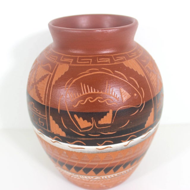 Width: 4.5 inches Height: 6.5 inches About this item Vintage red clay vase, hand painted, carved and etched with a Navajo...