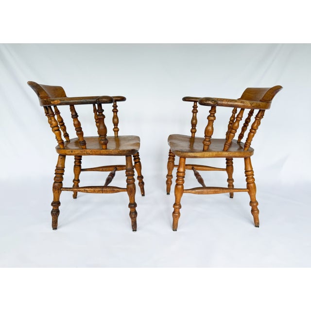 This style of chair was known as a smoker's bow chair, office chair, or Captain's chair. They were often found in offices,...