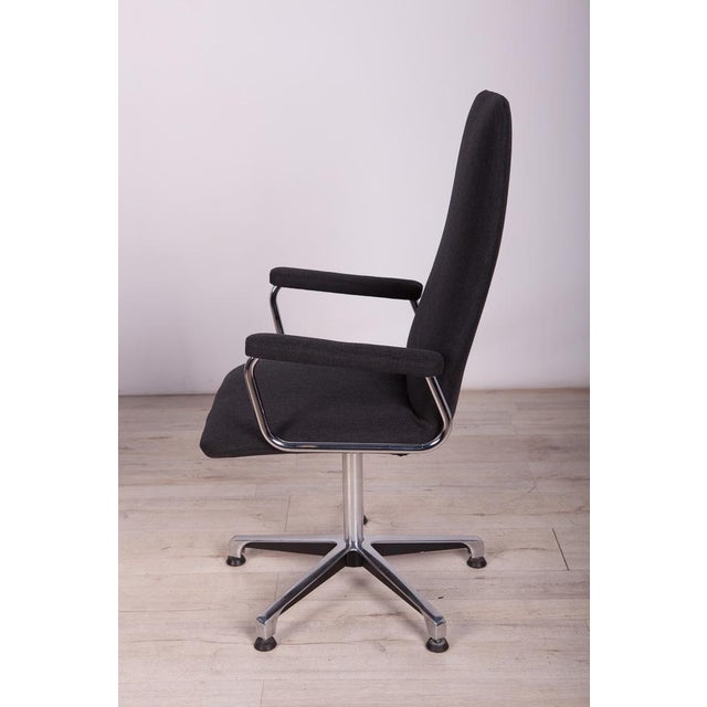 A set of four swivel conference chairs manufactured by Johanson Design in Sweden in the 1990s. The upholstery interior has...