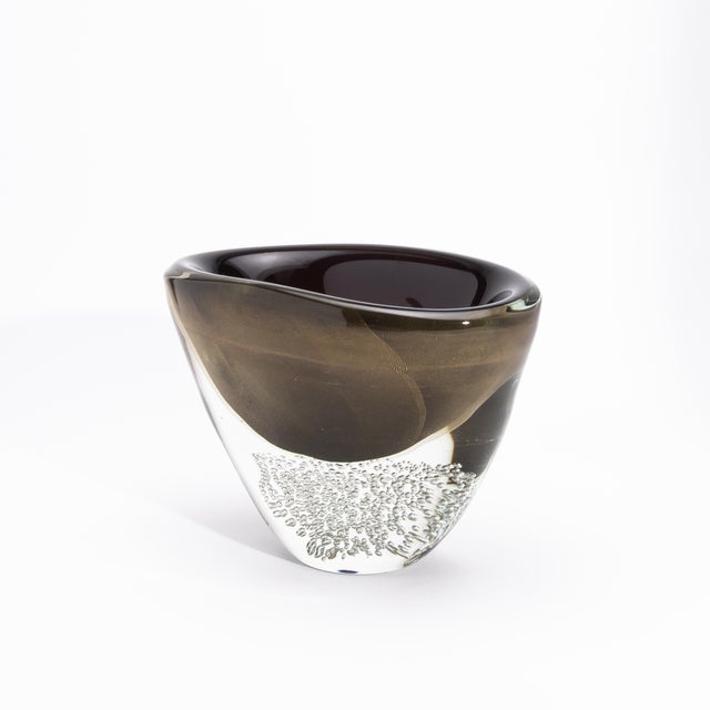 The Hand-Blown Modern Murano Bowl in Black / Clear with 24-karat Gold Flecks and Bubbles is a masterful expression of...