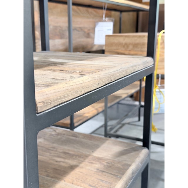 A striking Fulton desk by Restoration Hardware, pairing the warmth and natural character of reclaimed elm with a slender...