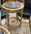 Add a touch of timeless sophistication to your interior with this elegant French-inspired side table, featuring an ornate...
