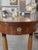 Oval Biedermeier-style table made of cherry wood partially ebonized, one drawer, turned column feet