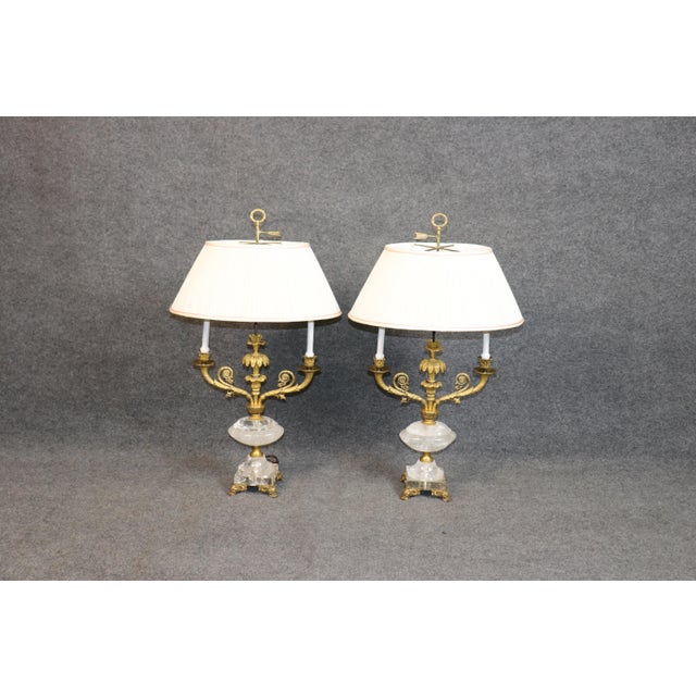 This elegant pair of French neoclassical table lamps beautifully combines the timeless sophistication of carved crystal...