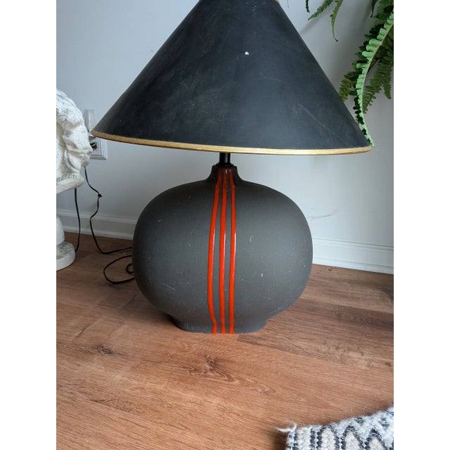 The item is a Post Modern ceramic table lamp by Sunset Cosco. This lamp is a vintage piece from the 1980s or 1990s. The...