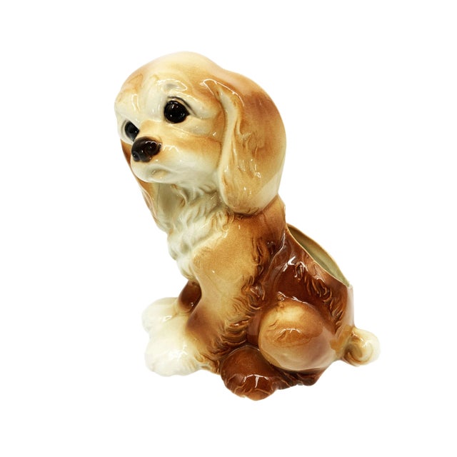 This Mid Century puppy planter is a delightful nod to the whimsical spirit of mid-century design. Crafted with endearing...