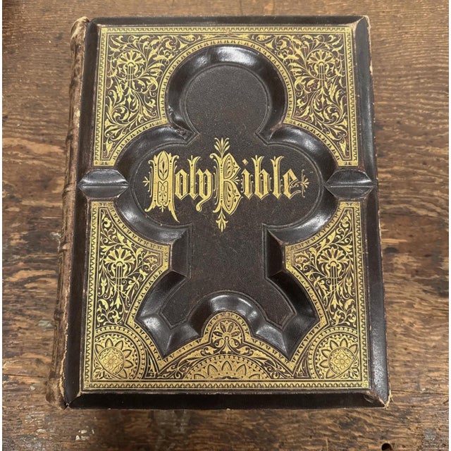 A Holy Bible from 1883 that includes an illustrated history of the New and Old Testaments. This handmade Bible was crafted...