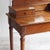 French dressing table (coiffeuse) from around 1910 with a swiveling beveled mirror and three drawers. The design is...