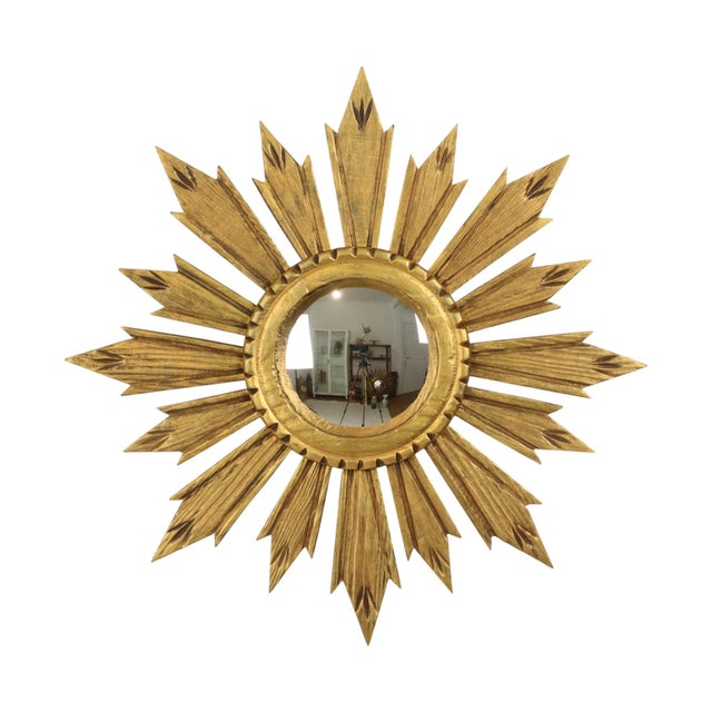Vintage sunburst mirror, featuring a central convex mirror and a frame made of gilded gold, handcrafted in the 1960s-70s,...