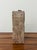 A charming hand-painted wine storage chest featuring a faux bois finish accented with a botanical floral panel and carved...