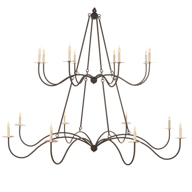 The Belfair two-tiered chandelier, not one but two graceful tiers of elegant swooping arms that provide functional rings...