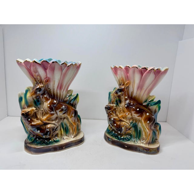 A delightful pair of 1950s mid-century figural ceramic pocket vases featuring an ornate relief motif of a mother doe and...