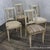 An elegant set of four Neoclassical style French painted dining room chairs, circa 1920. This stunning set of Neoclassical...
