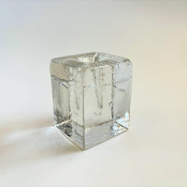 A vintage glass candle holder. Nice blocky shape, could also be used as a bud vase. Measures 2.25"W x 2"D x 2.75"H