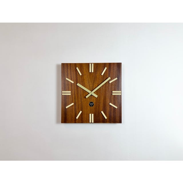 Wall clock, model PPH 410, produced by Pragotron in former Czechoslovakia during the 1980s. It features a brown wooden...