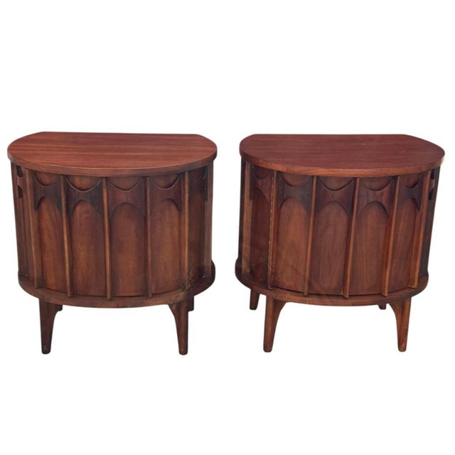 Walnut construction with signature Perspecta sculpted panel fronts. Rounded case with softened top edge. Raised on tapered...