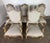 A beautiful and impressive set of eight French Louis XV–style carved dining chairs, including two armchairs (fauteuils)...