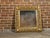 An Italian giltwood square-shaped mirror from the mid 20th century with openwork carved foliage and acanthus leaves...