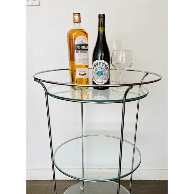 If you crave that mid century mod appeal, you'll love this 1970s 3 tiered chrome and glass bar cart. Serve your guests in...