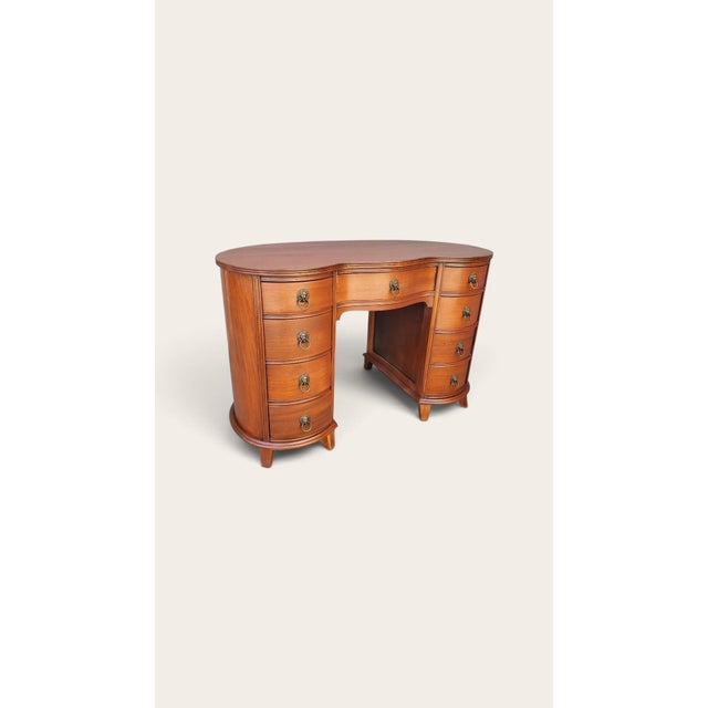 Vintage later 30s early 40s mahogany desk. The desk has a unique kidney shape, super clean, all drawers feature dovetail...