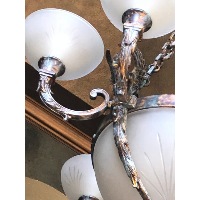 Handmade in Europe by Italian artisans. This stately, neo-classical chandelier is superbly executed in cast bronze to...