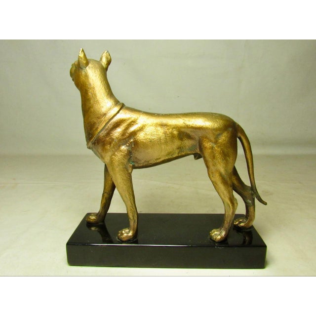 Vintage English gilt metal Doberman figurine mounted on a marble base, c. 1940’s Cast in metal with a gold wash, this...
