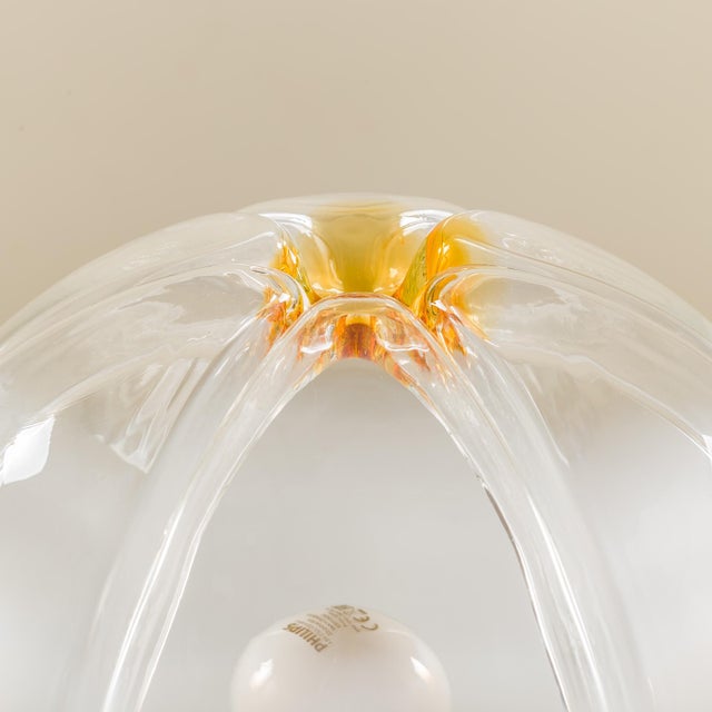 A murano glass table lamp produced by mazzega in italy in the 1970s, when space age design was at the height of its...