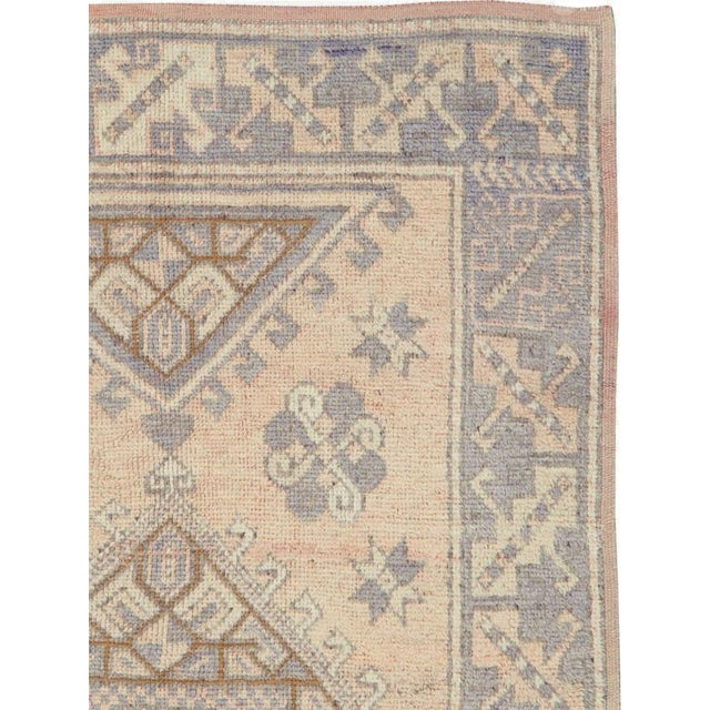 A vintage Turkish Anatolian accent rug. From the Bergama region of NW Turkey, this yellow field scatters displays a...