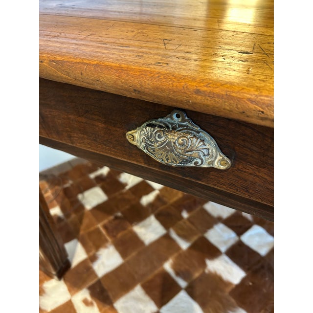 A rare find in this characterful country farm table from the Cotswolds, England, 19th century, fully restored, having...