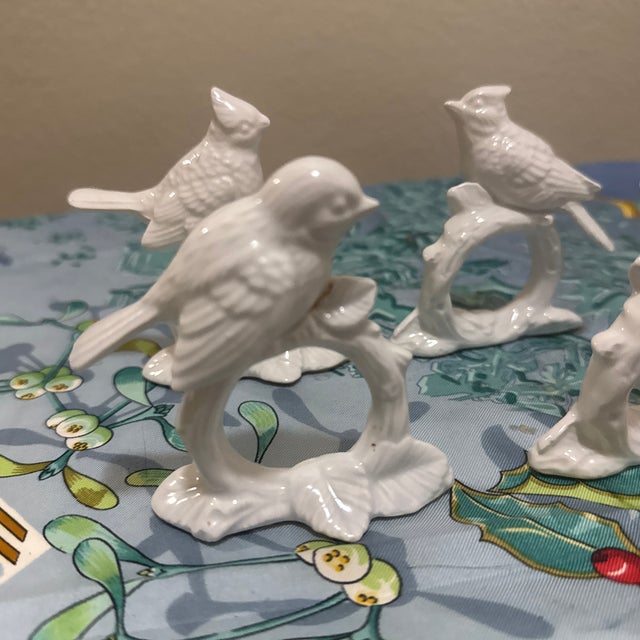 Add a touch of vintage elegance to your table setting with this beautiful set of four figural bird napkin rings. Crafted...
