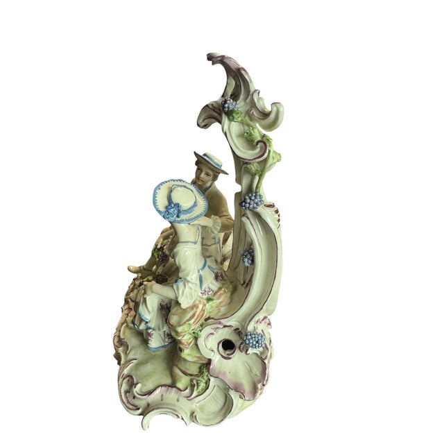 A charming 18th-century porcelain figure group from the ludwigsburg manufactory, depicting a courting couple in a rocaille...