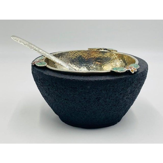 A striking silver-plated serving bowl with volcanic rock base, designed and handcrafted in Taxco, Mexico in the mid-1980s...