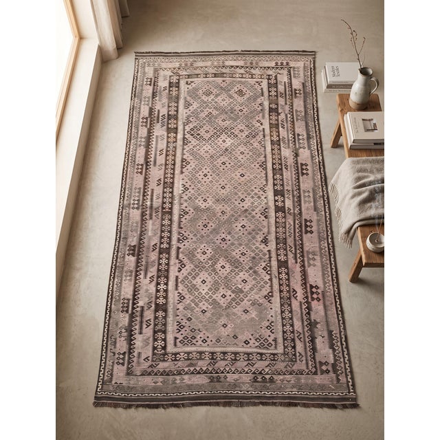A large handwoven Maimana kilim from northern Afghanistan, worked in a quiet palette of mushroom, dusty blush, grey-taupe...