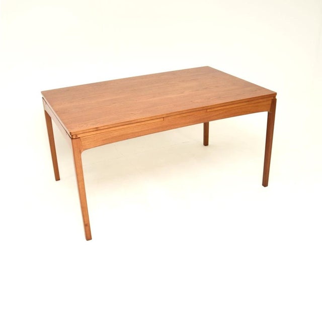 A superb vintage Danish teak extending dining table, dating from the 1960’s. This is of the utmost quality, with an...