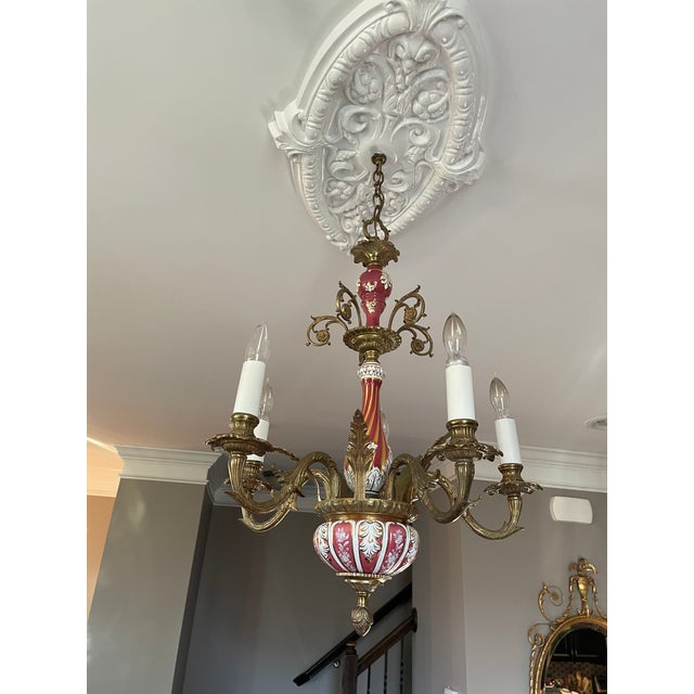 Beautiful 5 light brass and ceramic chandelier. The chandelier body is composed of three beautifully decorated ceramic...