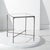 Enhance your living space with the Jessa forged metal square end table in silver. This striking piece combines the...
