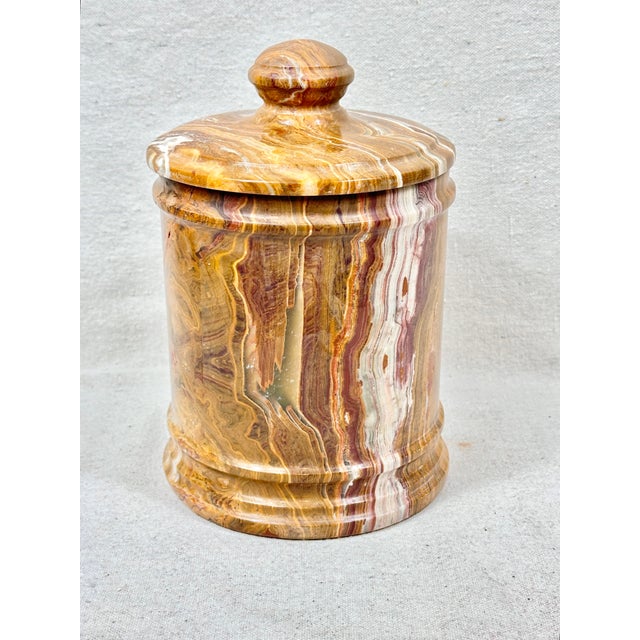 Unusual vintage stone lidded jar. Intricate design in the stone with loads of warm color ribbons throughout. Perfect to...