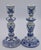 A stunning pair of mid-20th century Dutch Delft candlestick holders. These lovely candles depict floral and ornate motifs....