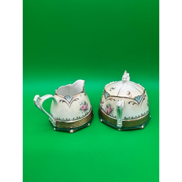Beautiful antique RS Prussia porcelain creamer and covered sugar set with lovely rose and peony floral decoration, soft...