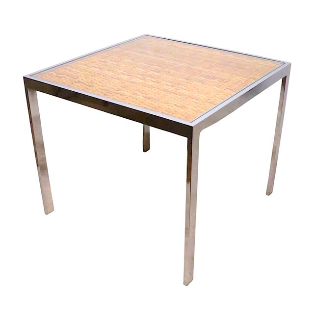 Chic Modernist side, end or small coffee table executed in chrome, wicker and tempered glass, this example is well...