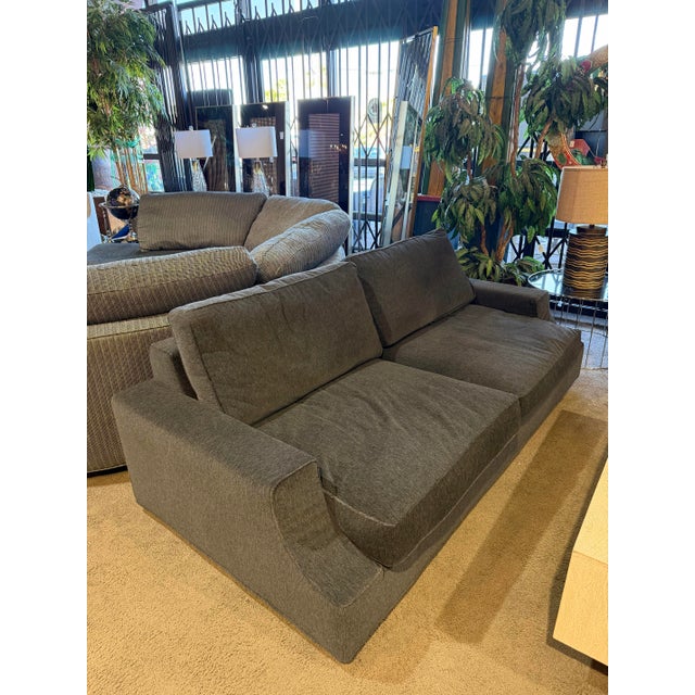 Elegant Sota sofa designed by Massimo Scolari for Giorgetti, crafted in Italy and upholstered in luxurious black and smoke...