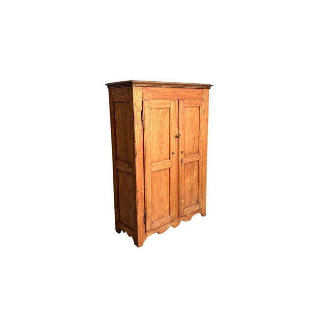 Antique 19th-century poplar mountain cabinet, featuring paneled sides that showcase its quality construction. with simple,...